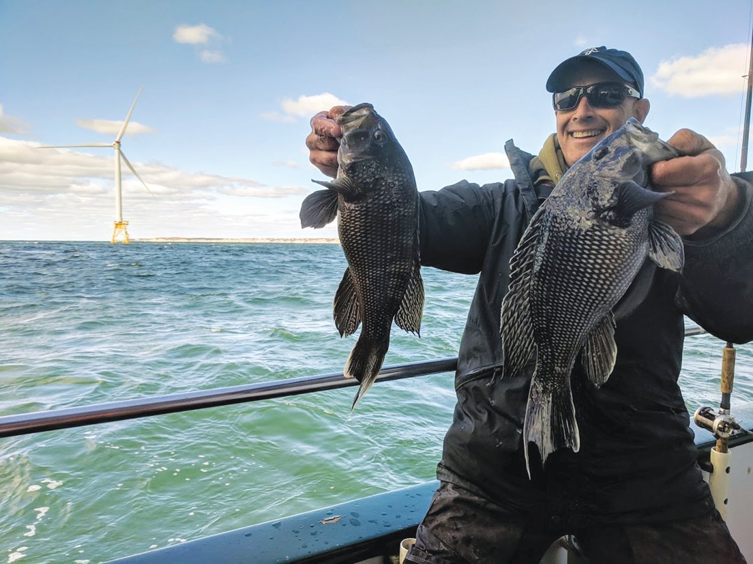 FISH AT WIND FARM:   Paul Eidman with black sea bass at the Block Island Wind Farm.  This year larger fish such as bluefish, striped bass, bluefin tuna and mahi mahi were in the area in too.